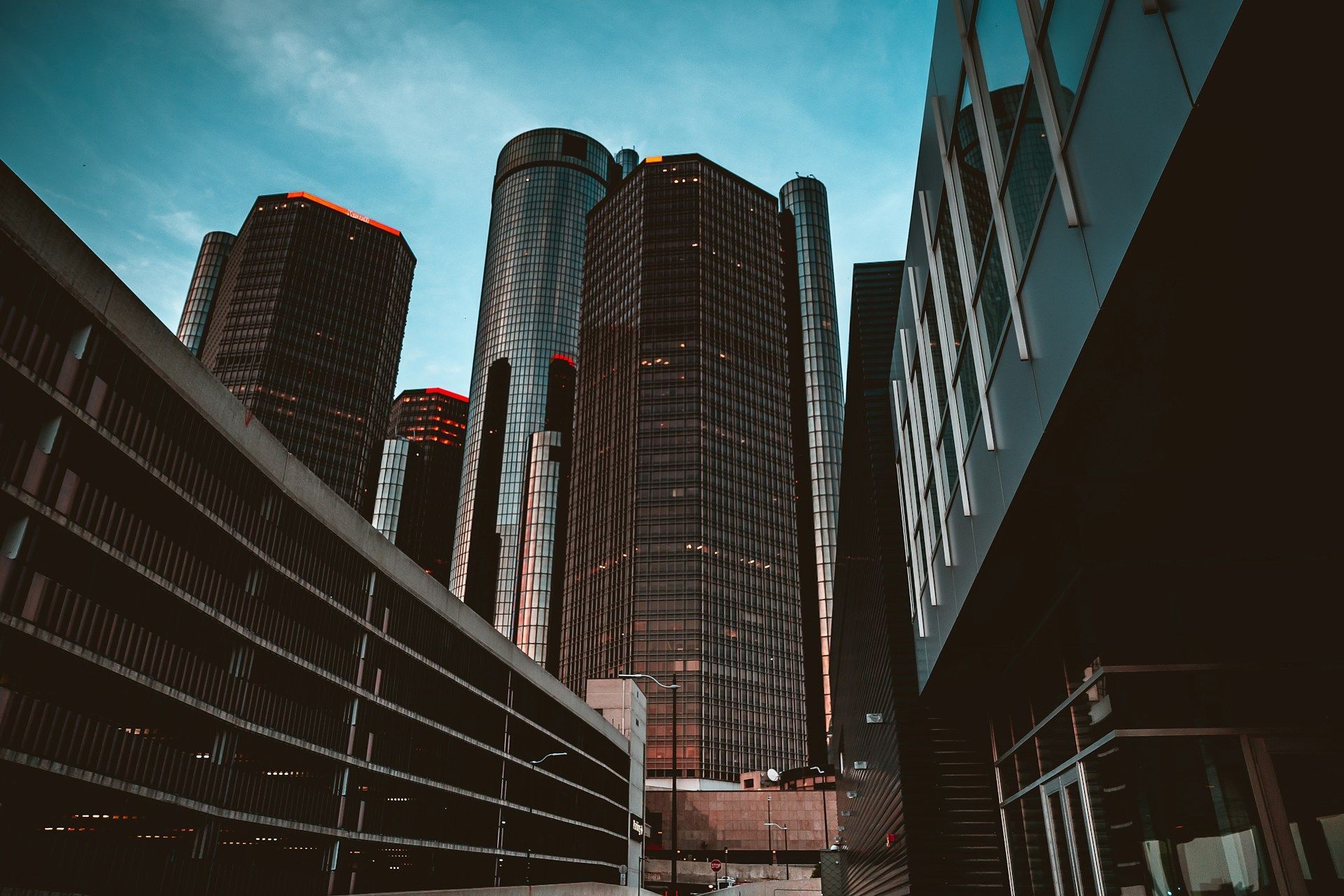 Looking up at a row of tall buildings in a city.