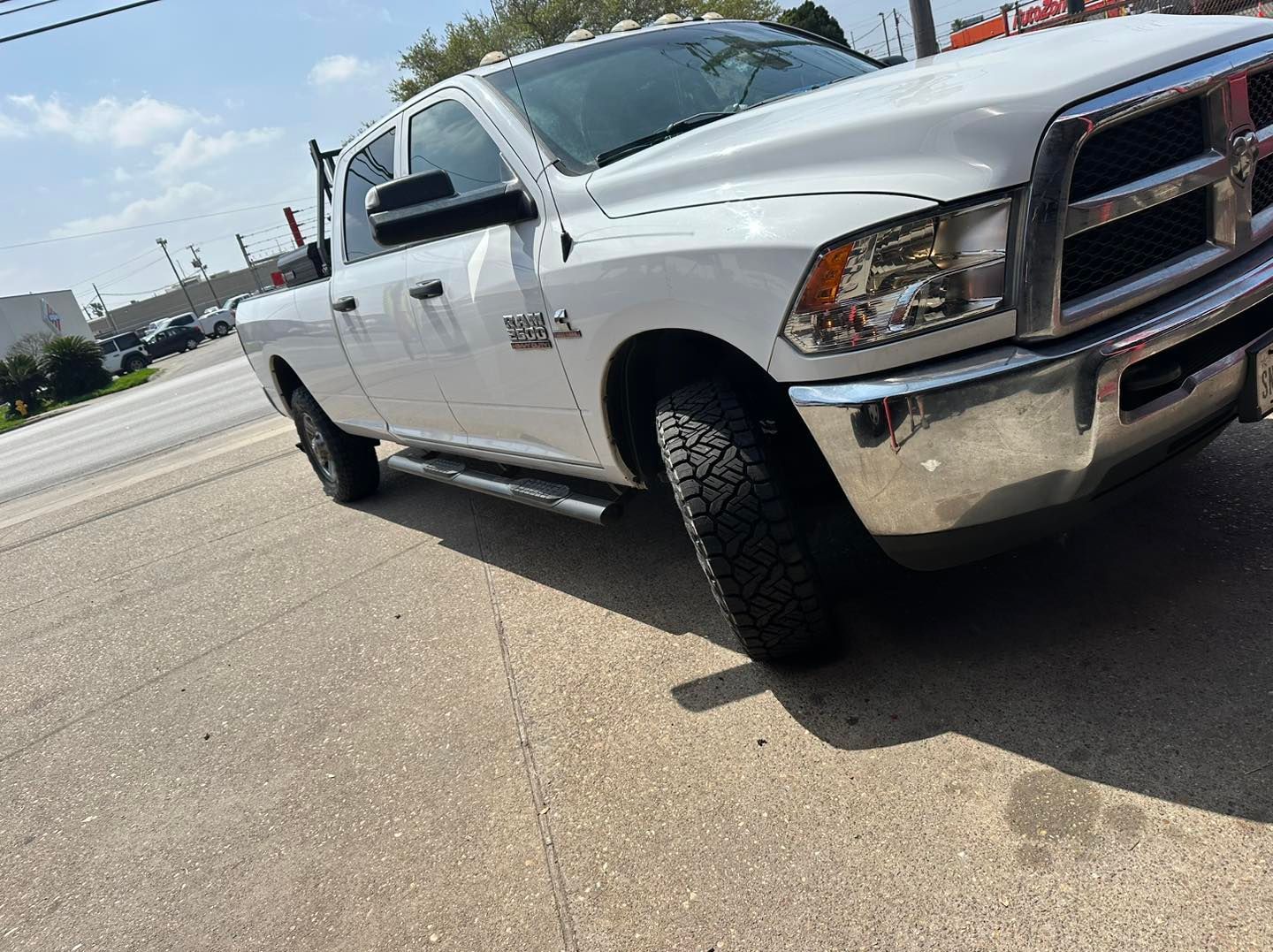 White Ram 2500 pickup truck parked on asphalt.