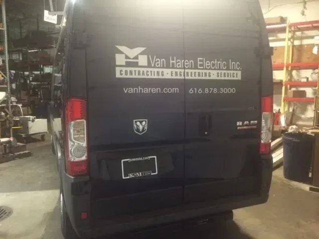 A van with van haren electric inc written on the back