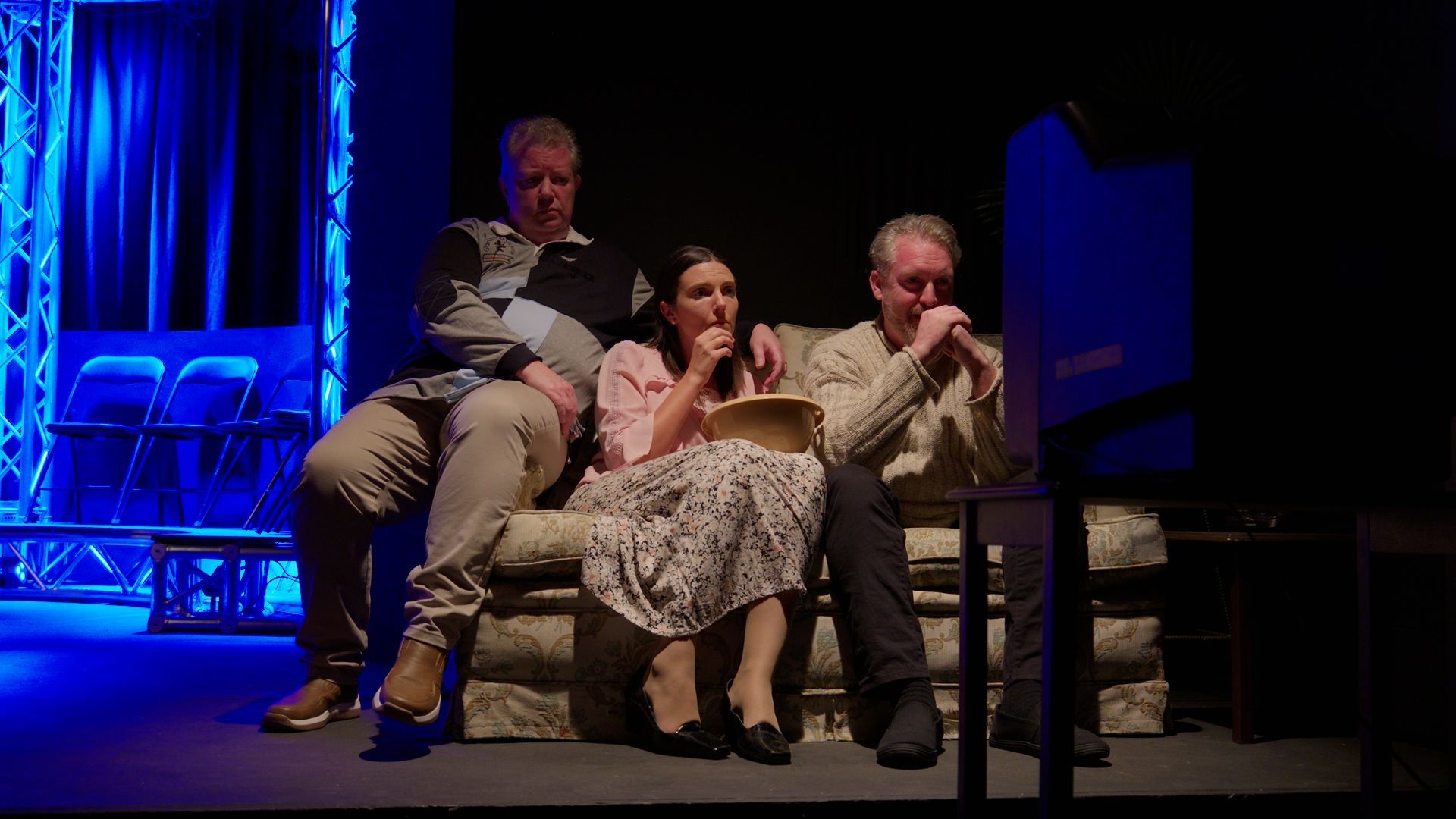 Theatre performers on stage.