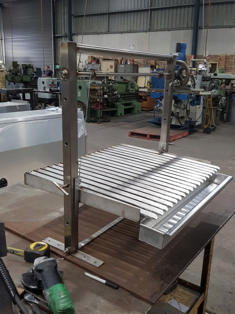 A Stainless Steel Grill Is Being Built in A Factory — Maitland Sheet Metal in Rutherford, NSW