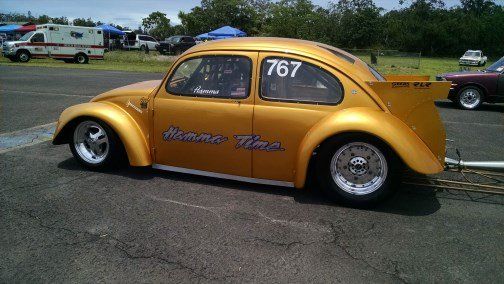 A yellow car with the number 767 on it