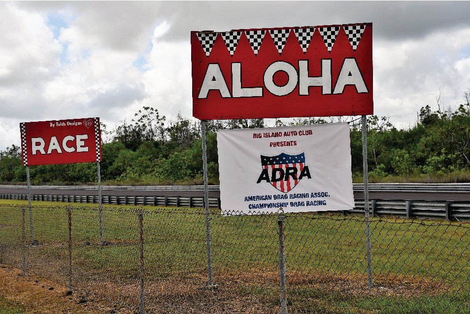 A red sign that says aloha on it