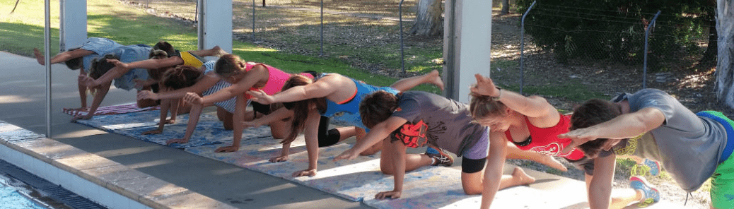 Swimmers Stretching Beside The Pool — Swim Training In Cannonvale, QLD