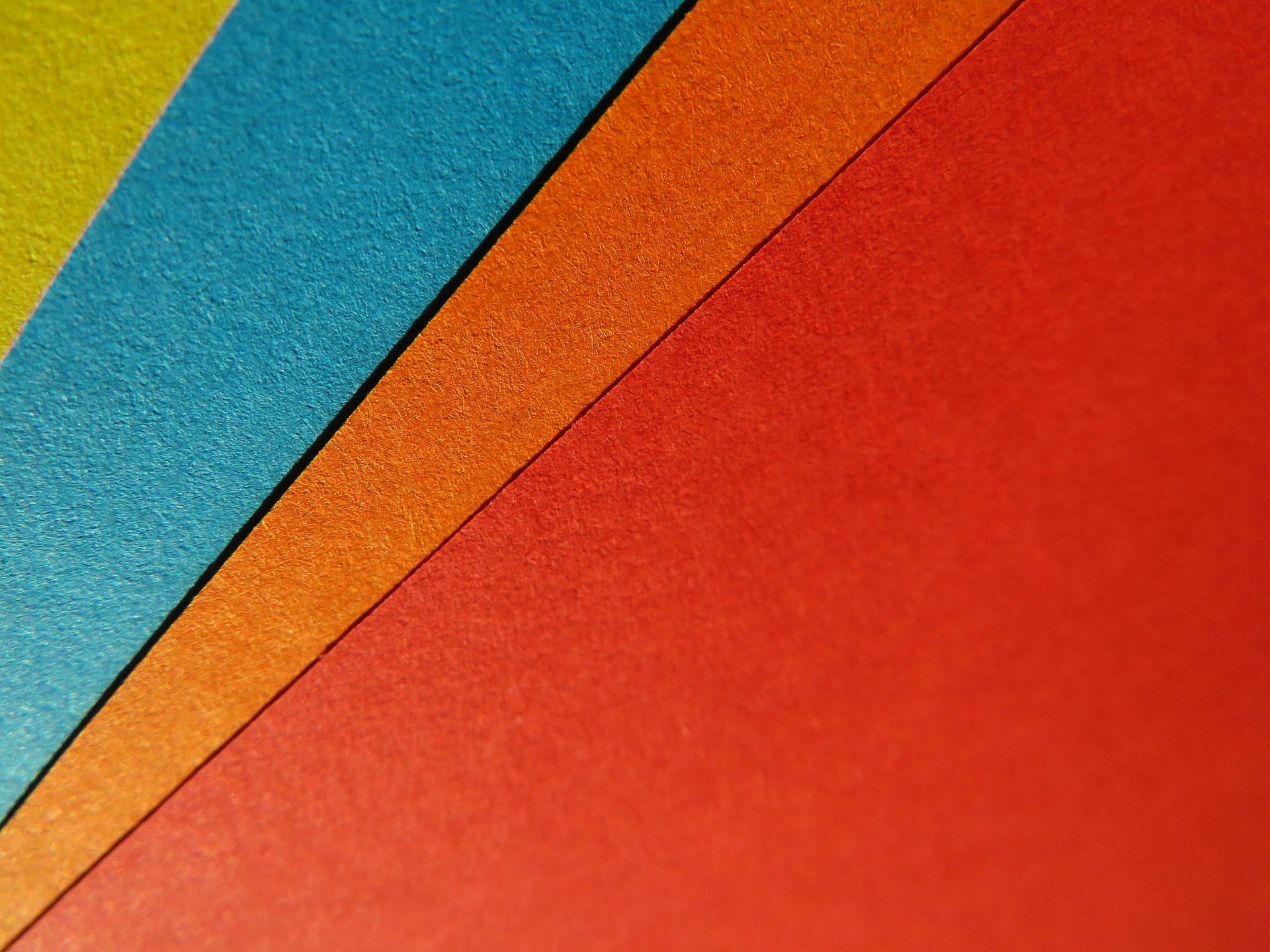 Paper samples in blue, orange, and red
