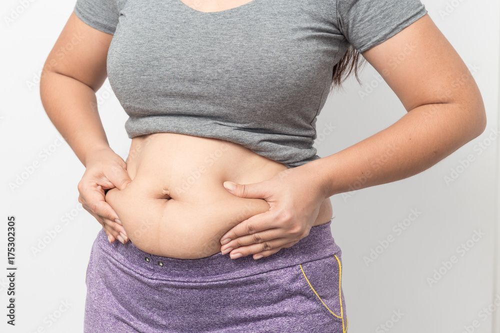 Person receiving body treatment with a handheld device on their side. Wrapped in white towels.