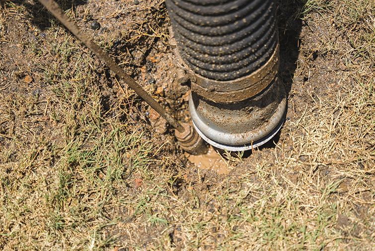A Close Up Of A Hose Laying On The Ground — All Hours Vac Truck In Lakes Creek, QLD