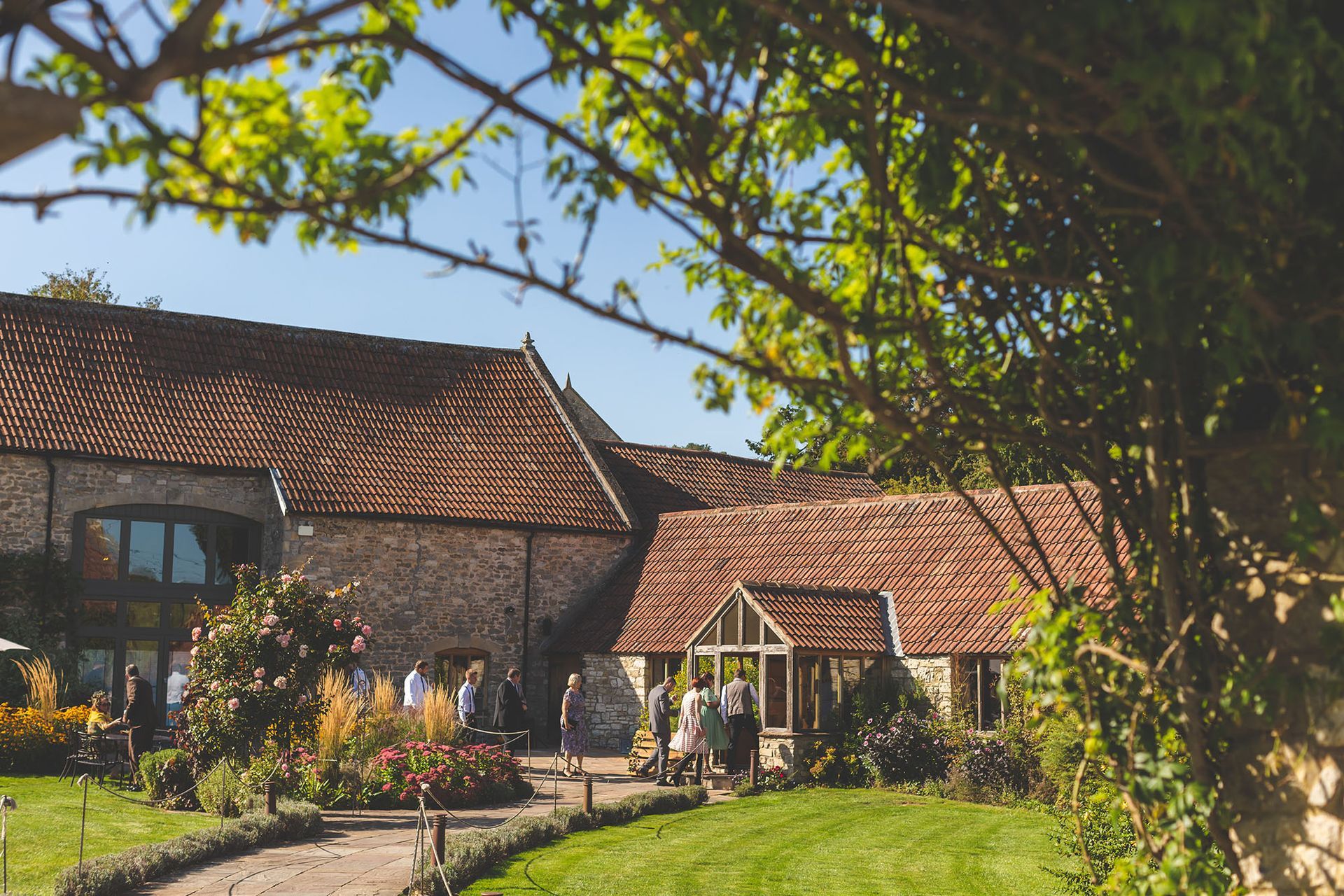 A group of people are standing in front of a large building.