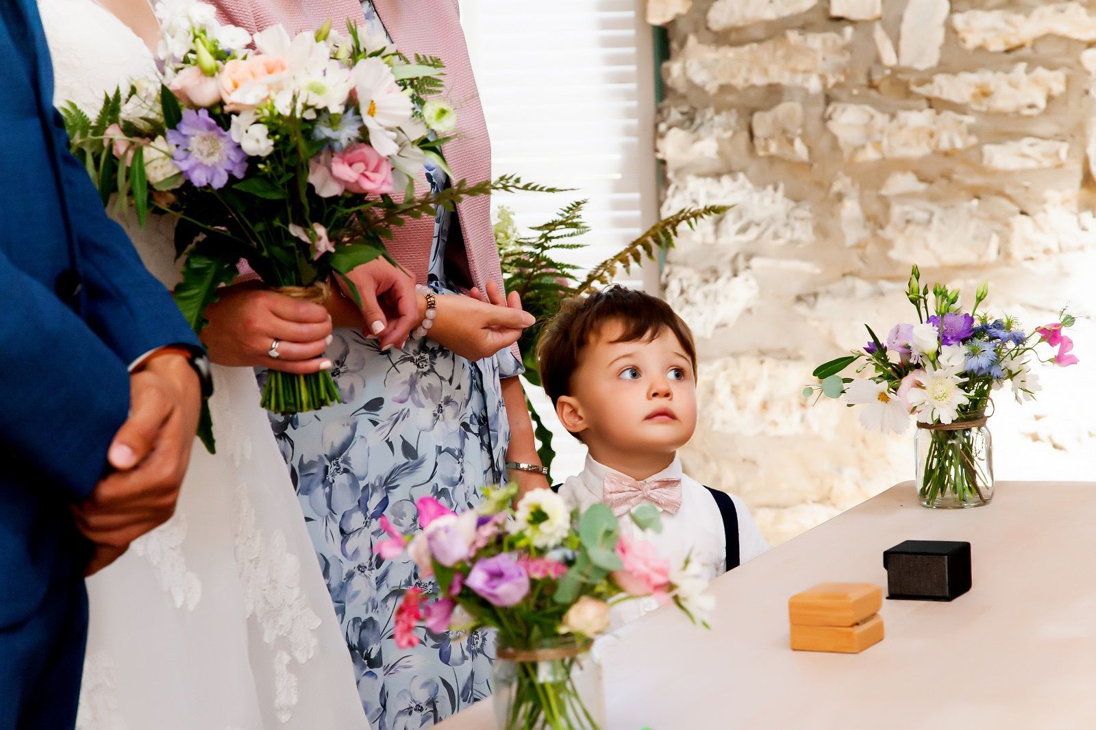 a bride and groom are posing for a picture in front of a garage door.
