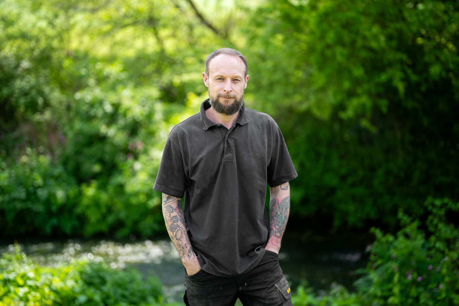 There is a house with a lot of flowers in front of it.