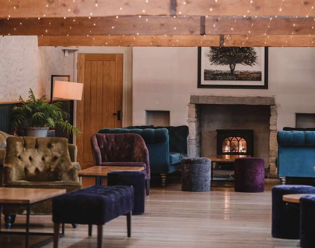 A living room filled with furniture and a fireplace.