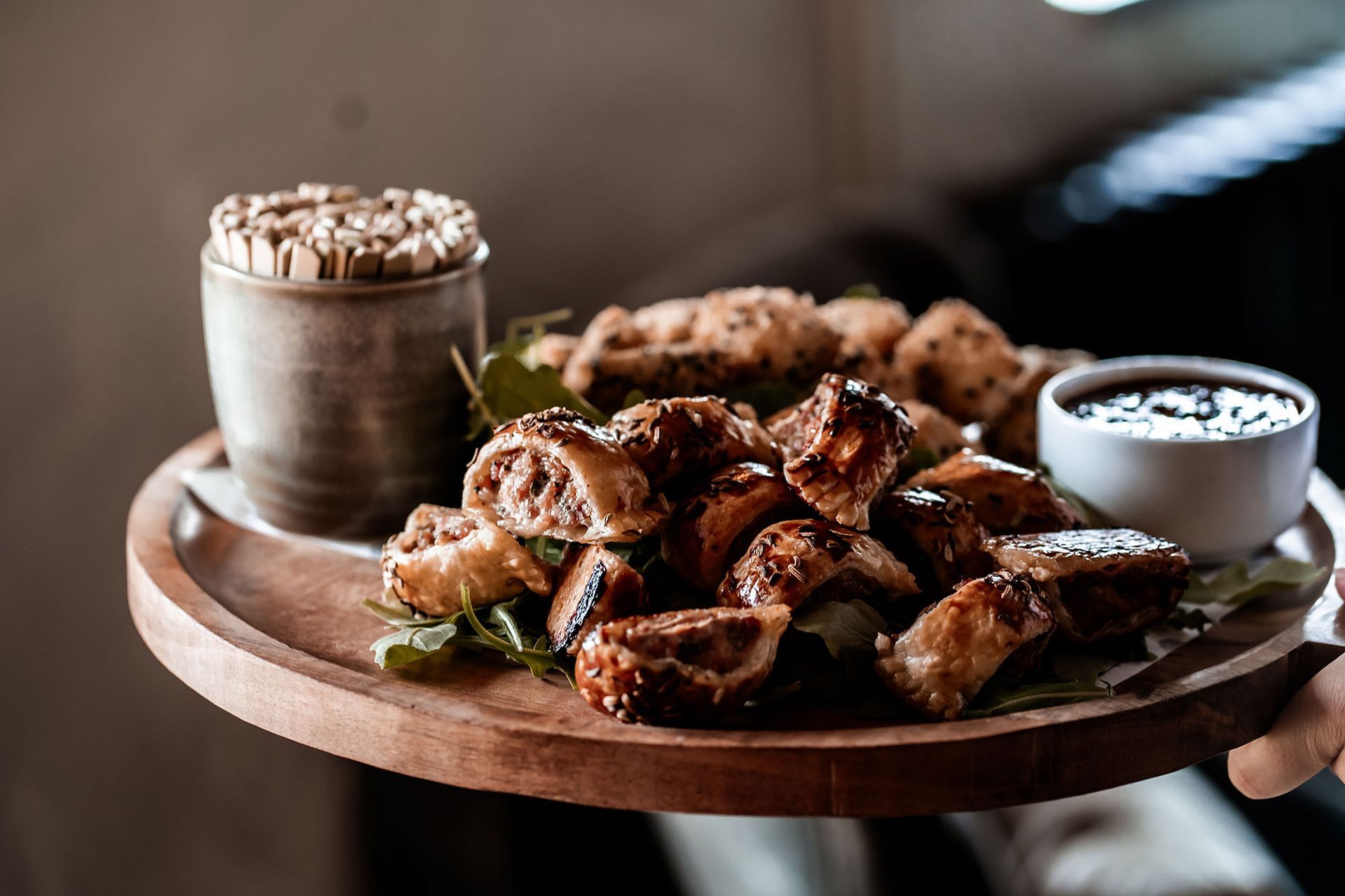 a white plate topped with fried food and sauce on a table .