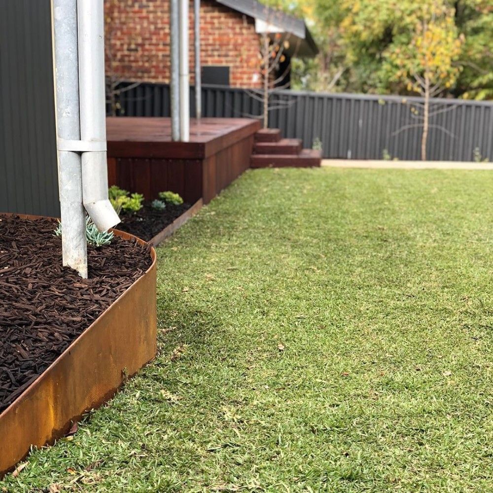 Beautiful Lawn With Straightcurve Retaining Wall — Landscaping Supplies in Bonny Hills NSW