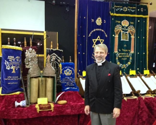Daryl Fenton with the Heritage Foundation Torah scroll collection