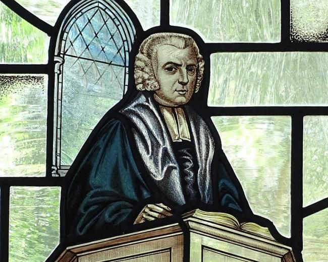 Stained glass of John Newton in his pulpit
