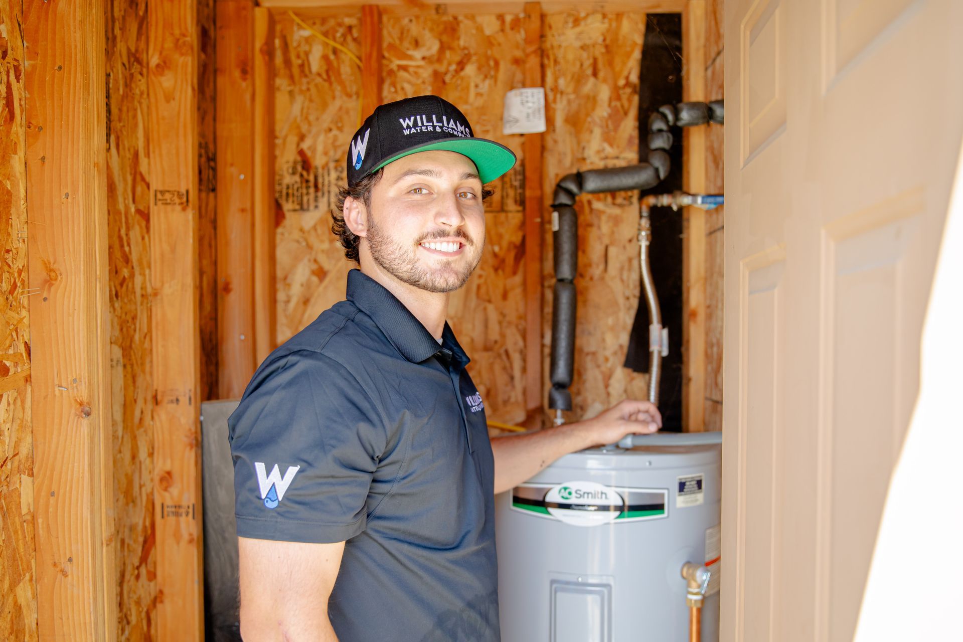 A shower head with water coming out of it against a blue sky.
