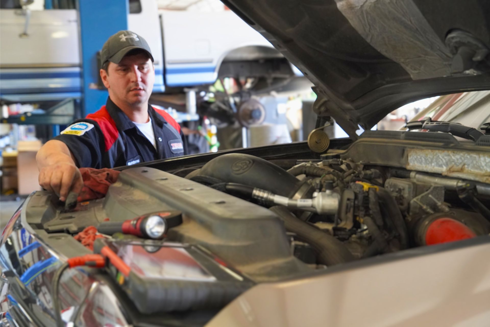 Texas Complete Truck Center Mechanic Inspecting Truck Engine Bay | Texas Complete Truck Center