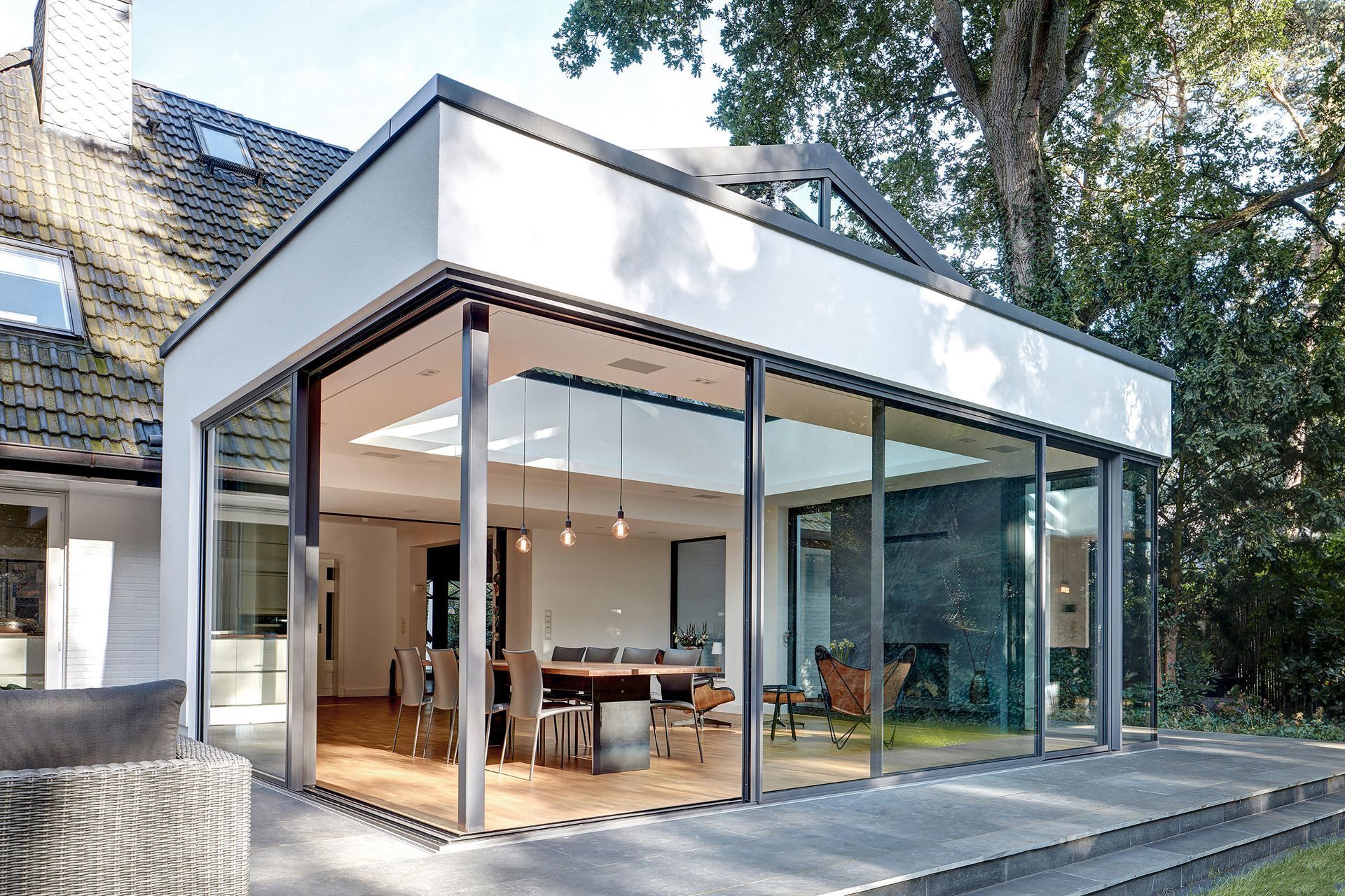 A white house with a large sliding glass door