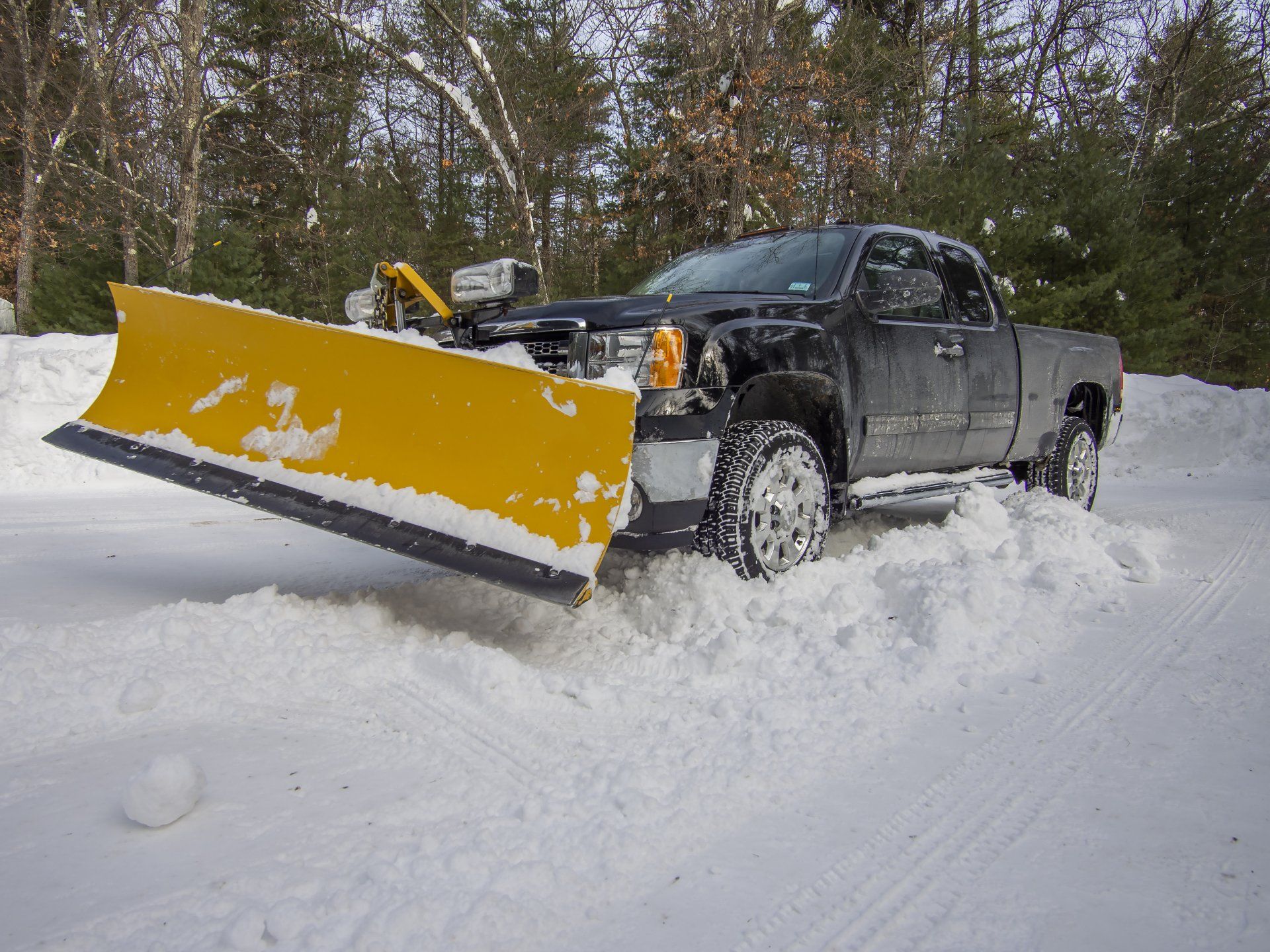 A truck plowing snow