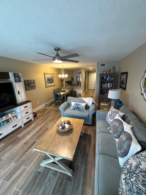 A living room with a couch a chair and a coffee table
