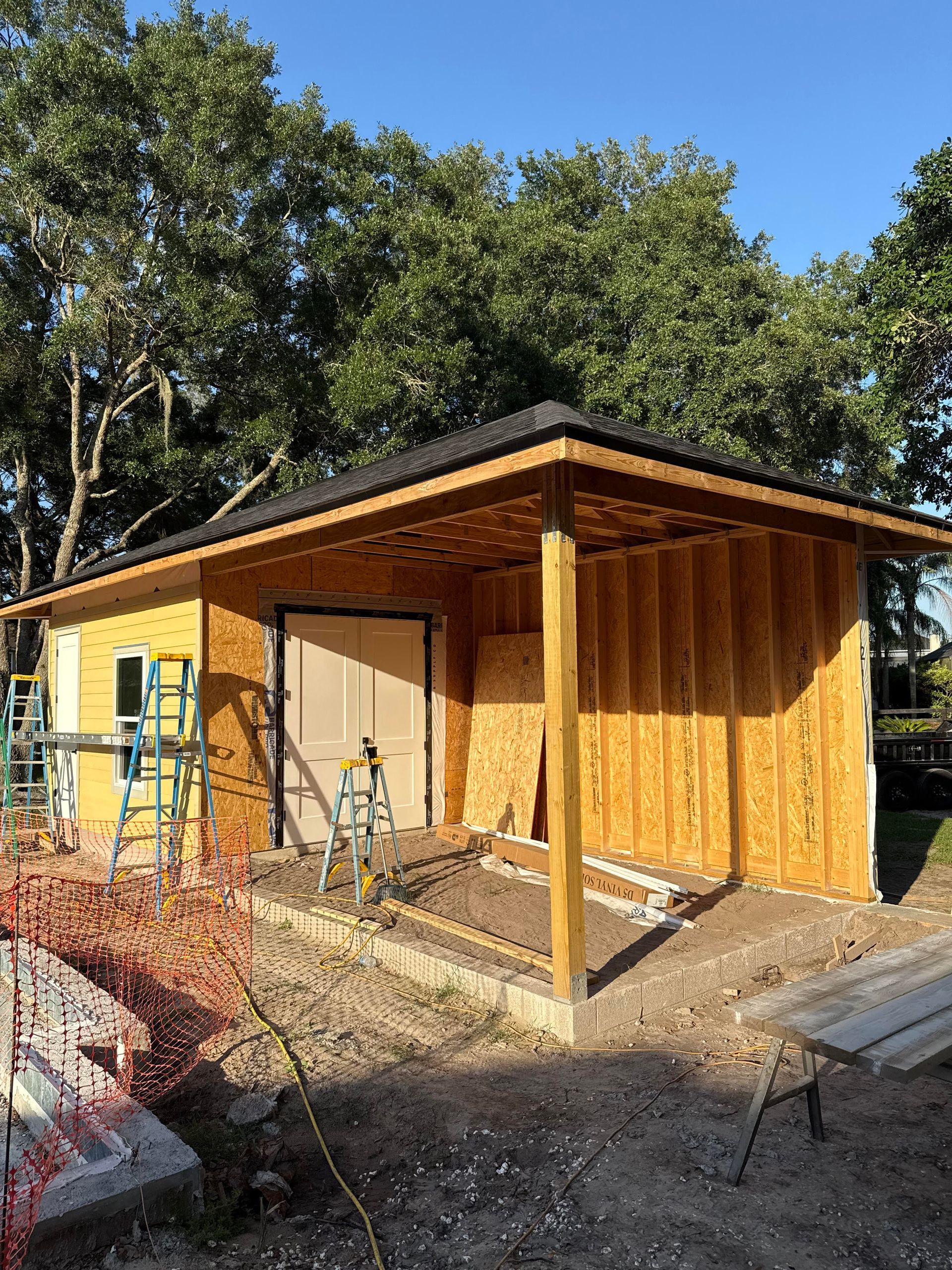 A bathroom with a sink , toilet , shower curtain and mirror.