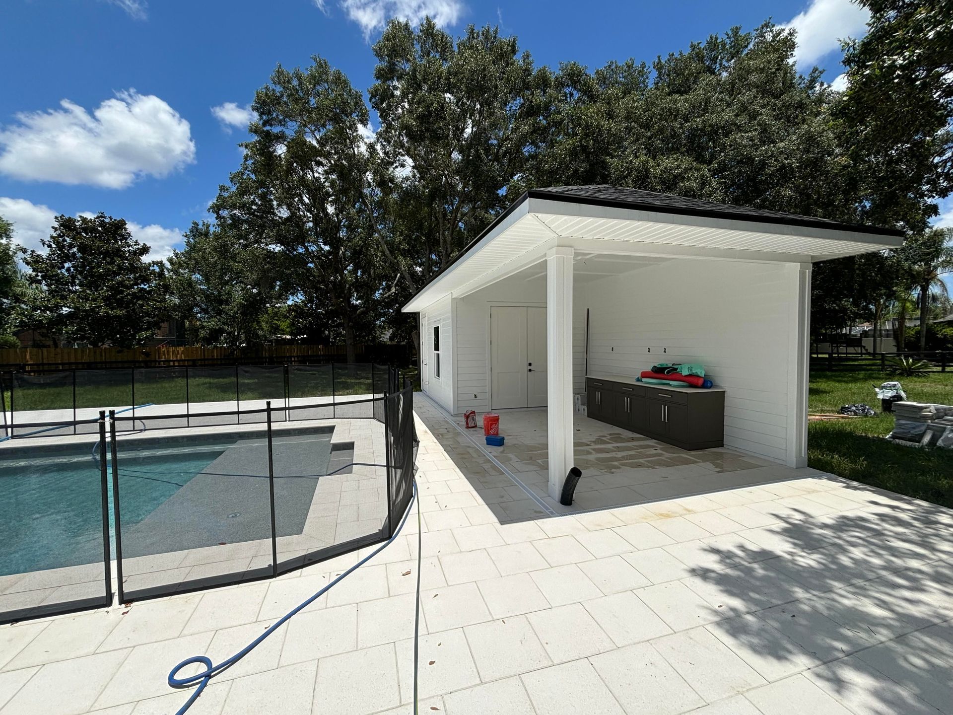 A bathroom with a sink , toilet , shower curtain and mirror.