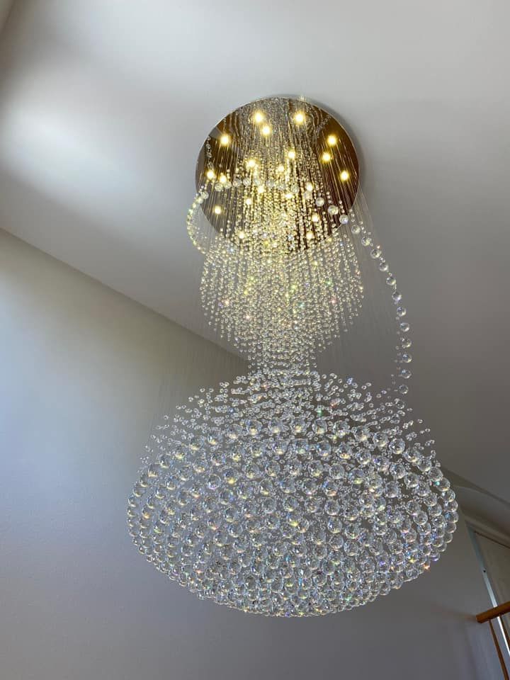 A large chandelier is hanging from the ceiling in a room.