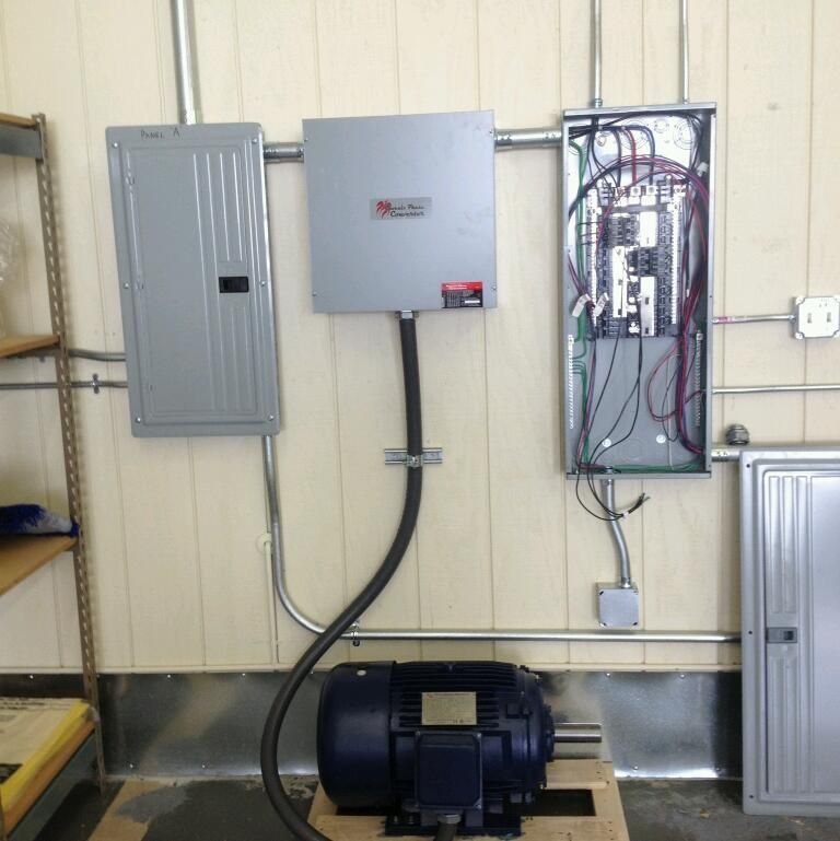 A motor is connected to an electrical box with a hose attached to it