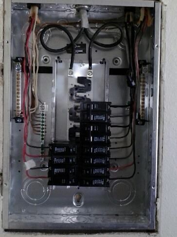 A electrical box with a lot of wires coming out of it