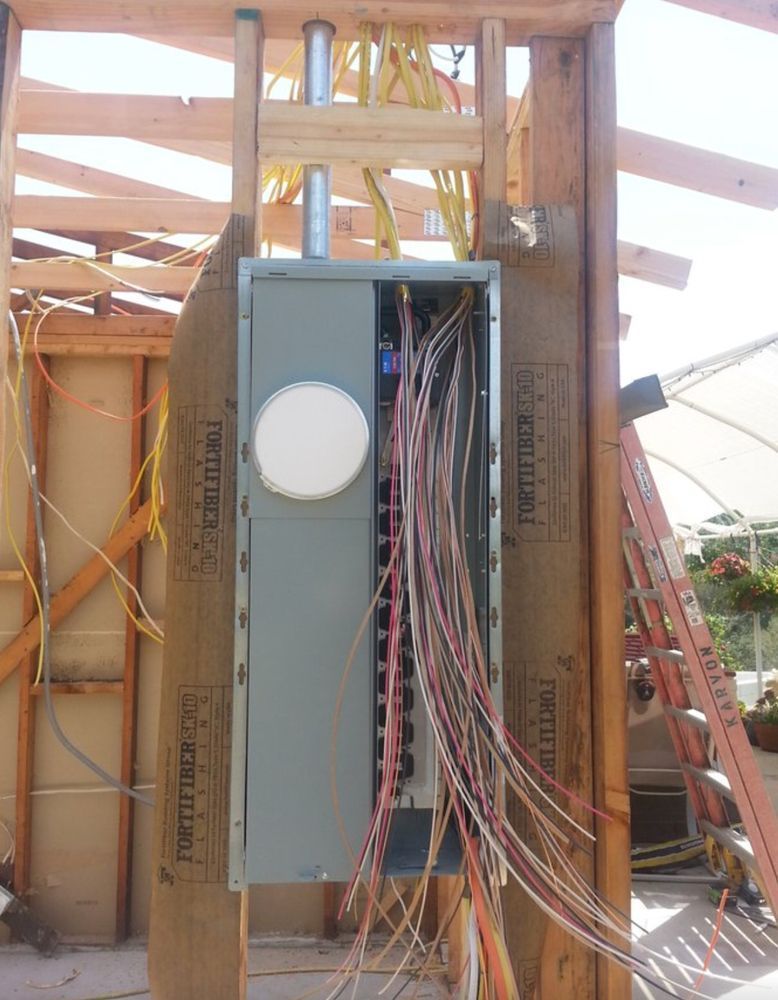 A building under construction with a ladder in the background