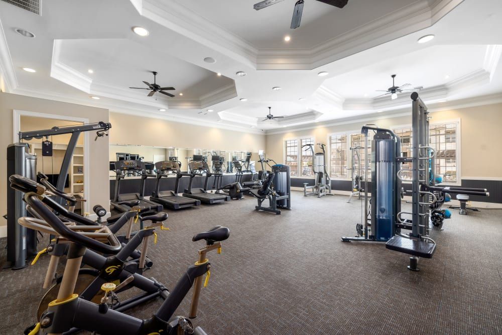 A large gym filled with lots of exercise equipment at Marquis Ellis Crossing in Durham, NC