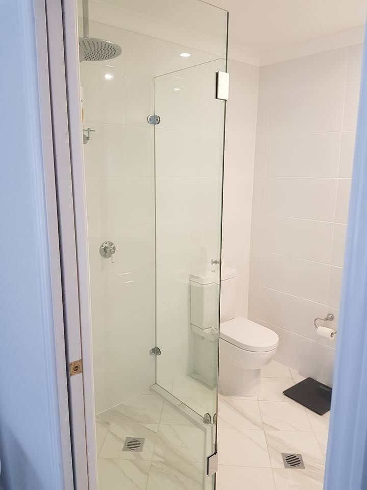 A Bathroom With a Toilet and a Walk in Shower — Moss Vale Glass In Moss Vale, NSW