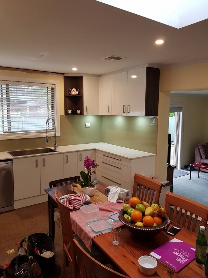 A Kitchen With a Table and Chairs and a Bowl of Fruit on It — Moss Vale Glass In Moss Vale, NSW