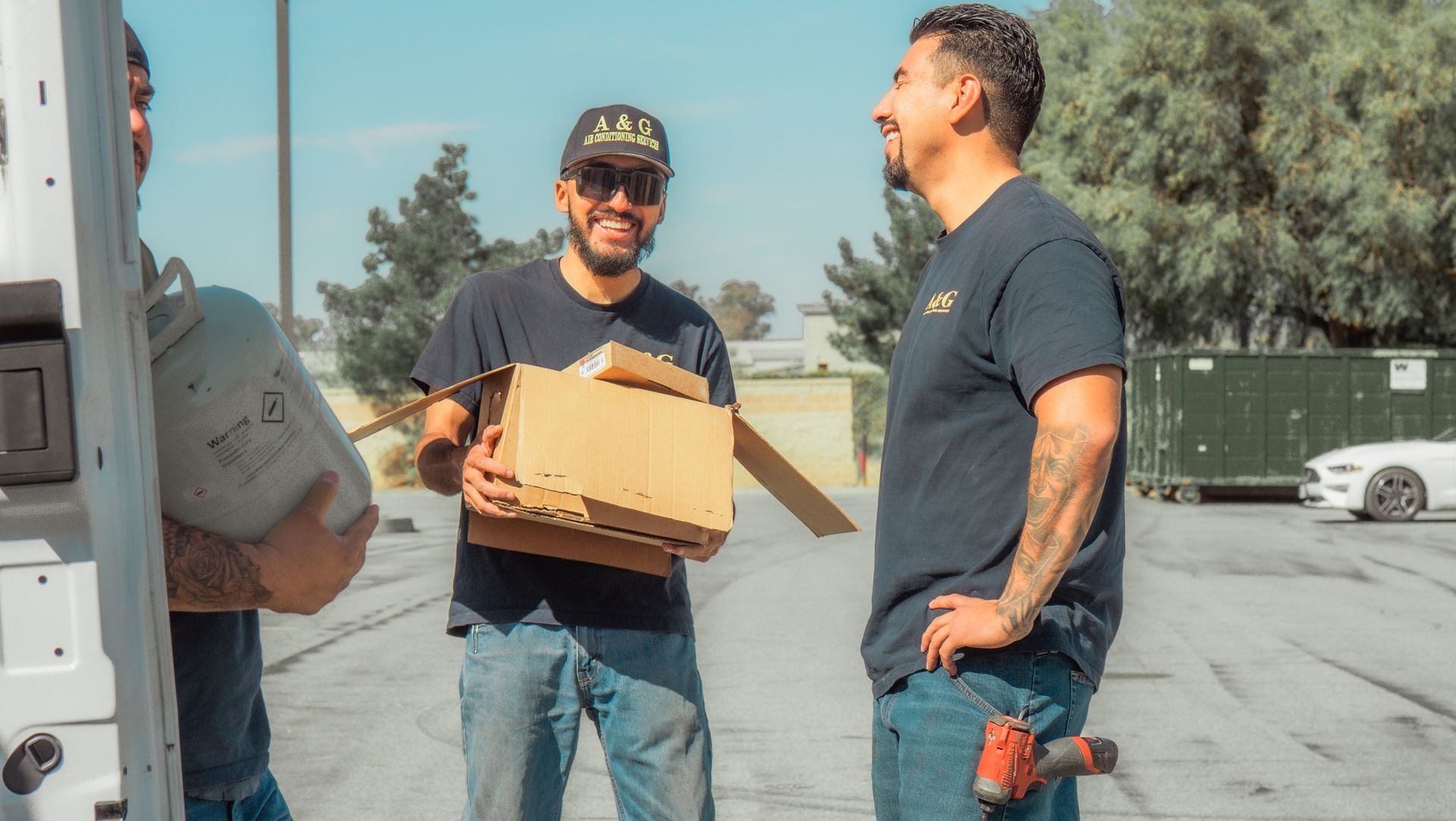 Two A & G Technician  are standing next to each other in a parking lot in San Bernardino County.