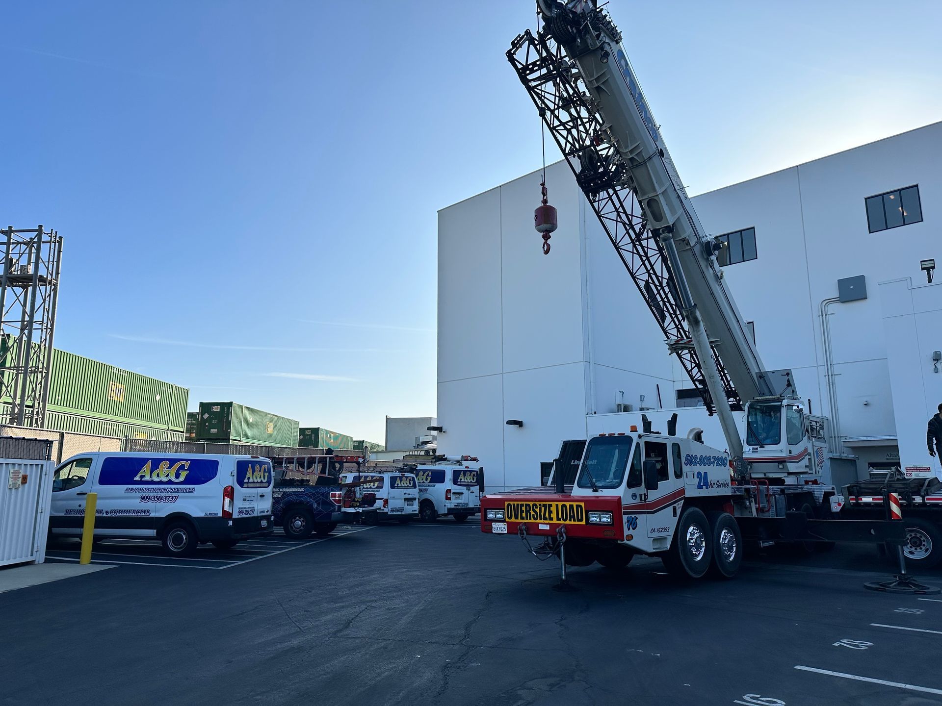 Two A & G Air Conditioning trucks are parked in front of a building in San Bernardino County.