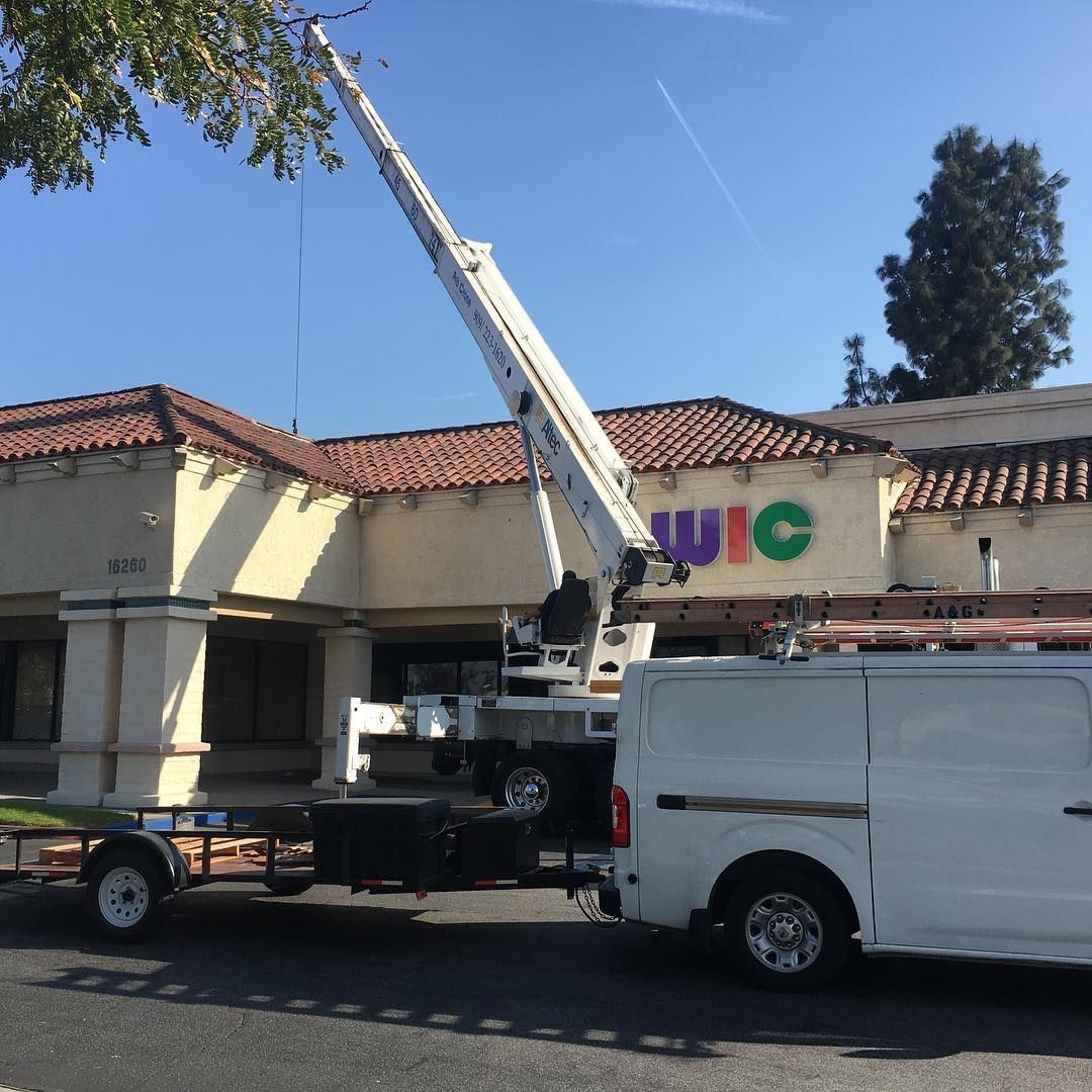 A & G Air Conditioning van is parked in front of a building that says uic in San Bernardino County.