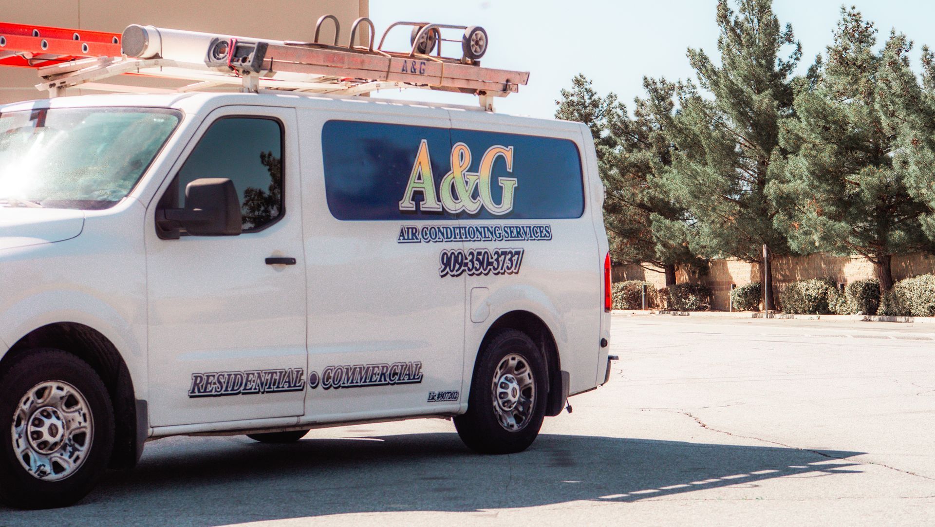 A & G Air Conditioning work van is parked in a parking lot in San Bernardino County.