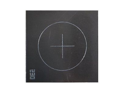 A black square with a circle and a cross on it