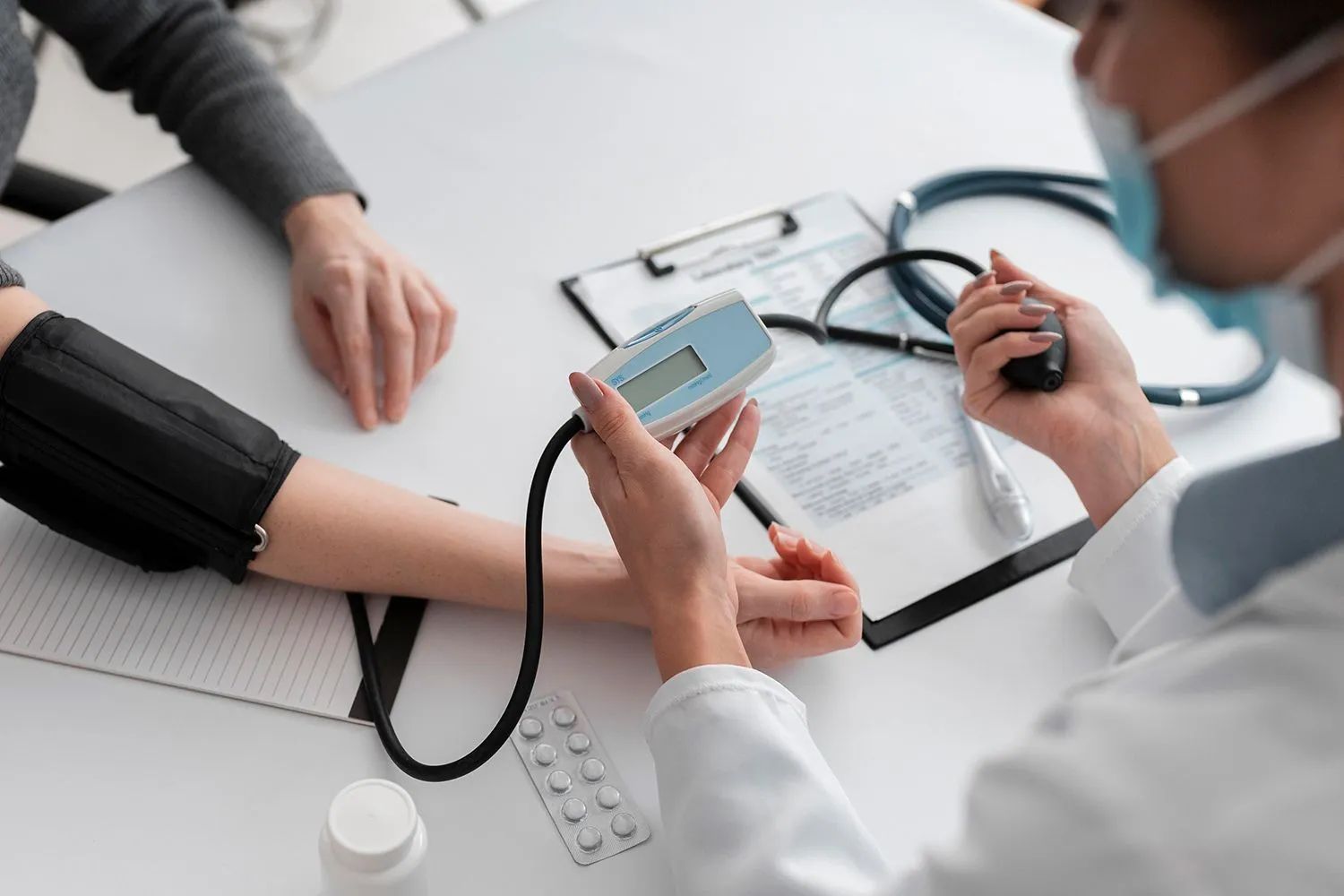 doctor checking the blood pressure