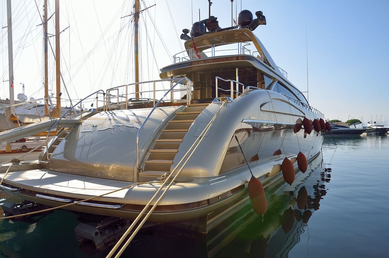 a large yacht is docked in a marina