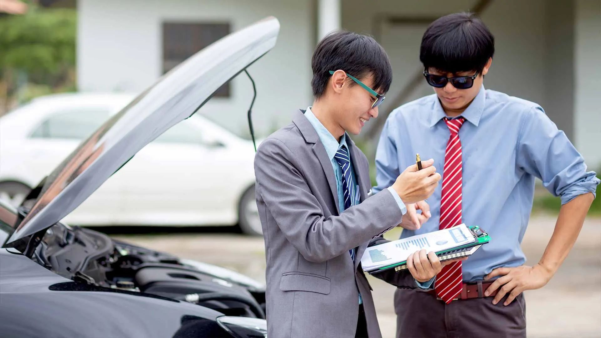 two men are looking at the document