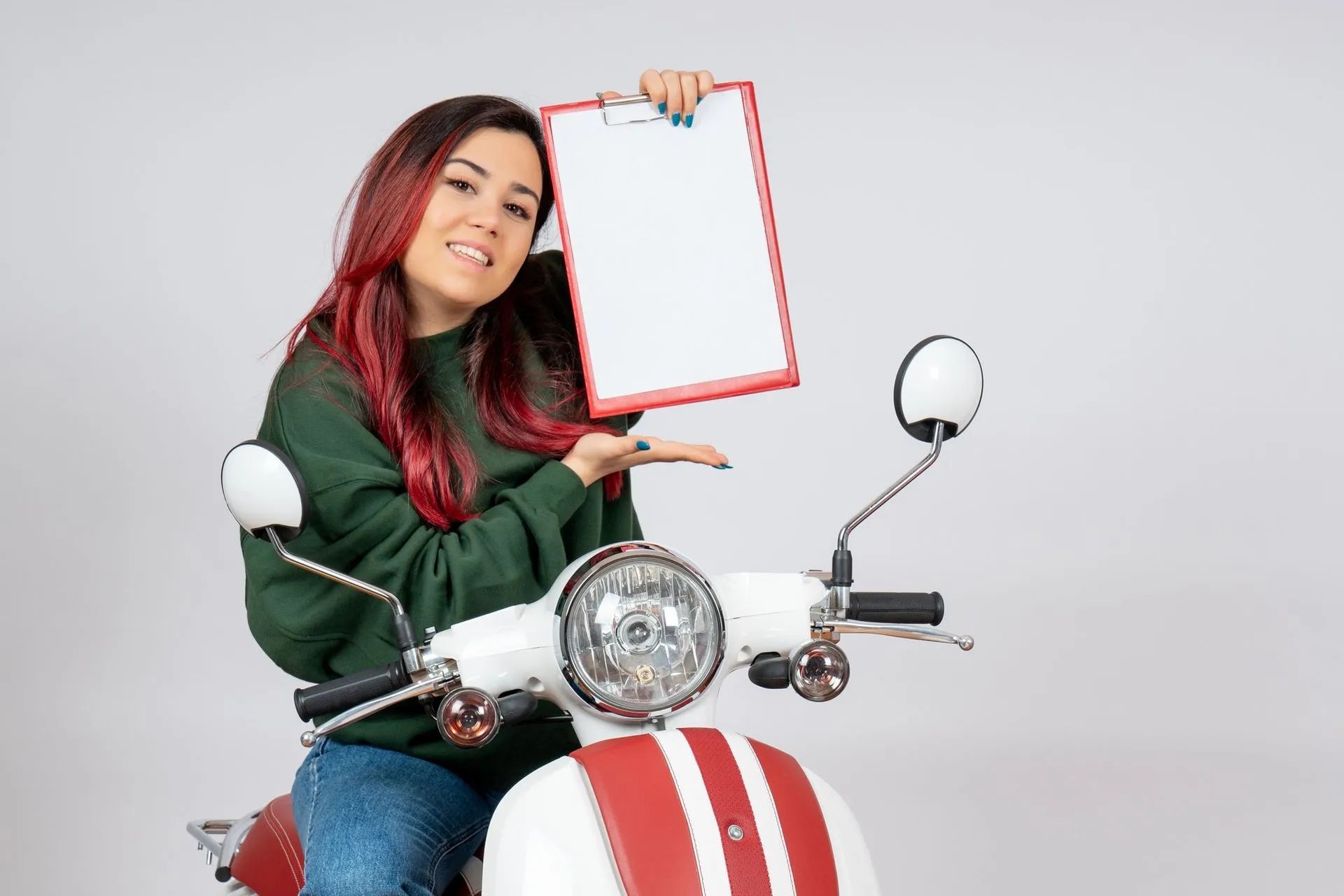 a woman is sitting on a scooter holding a clipboard