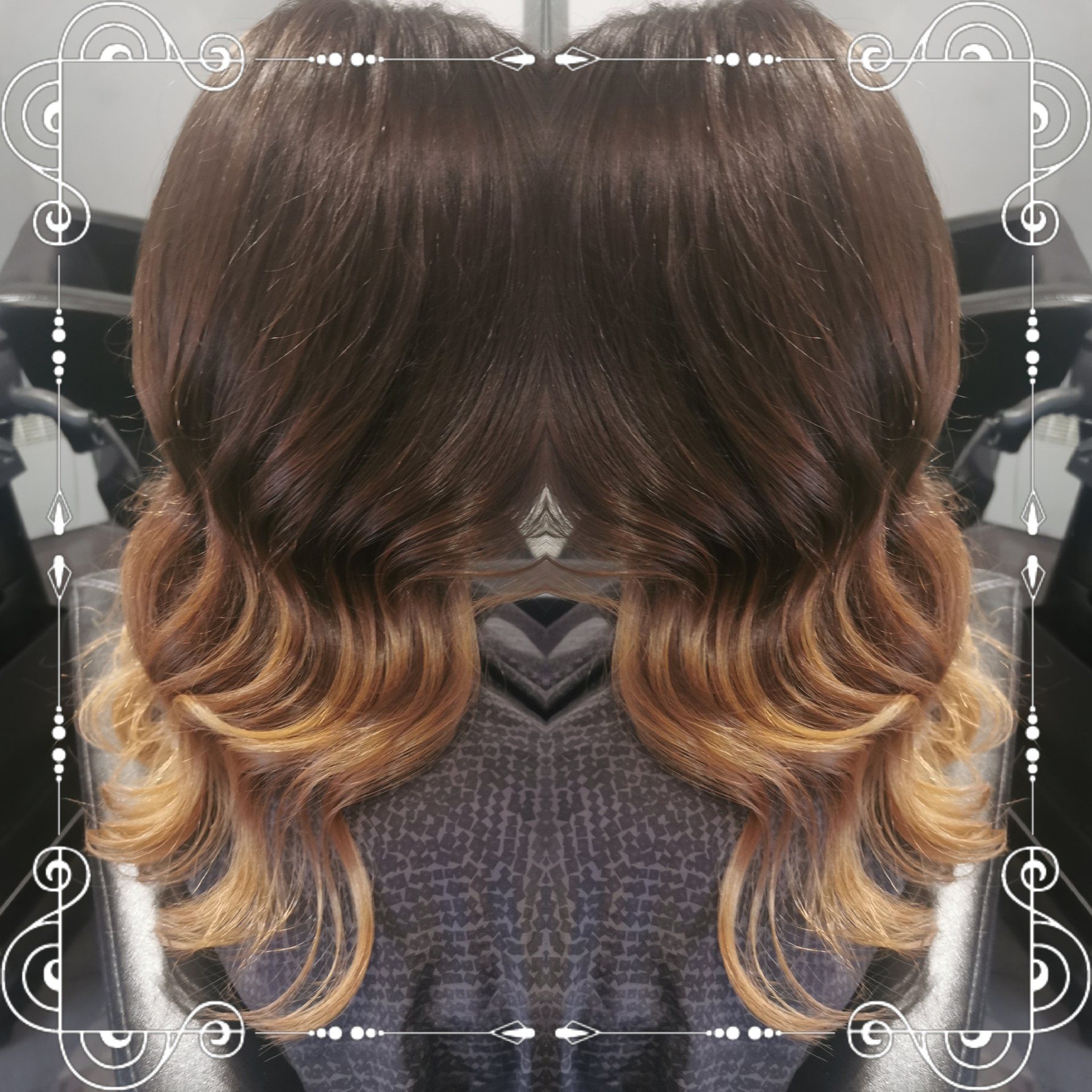 A reflection of a woman 's hair in a mirror