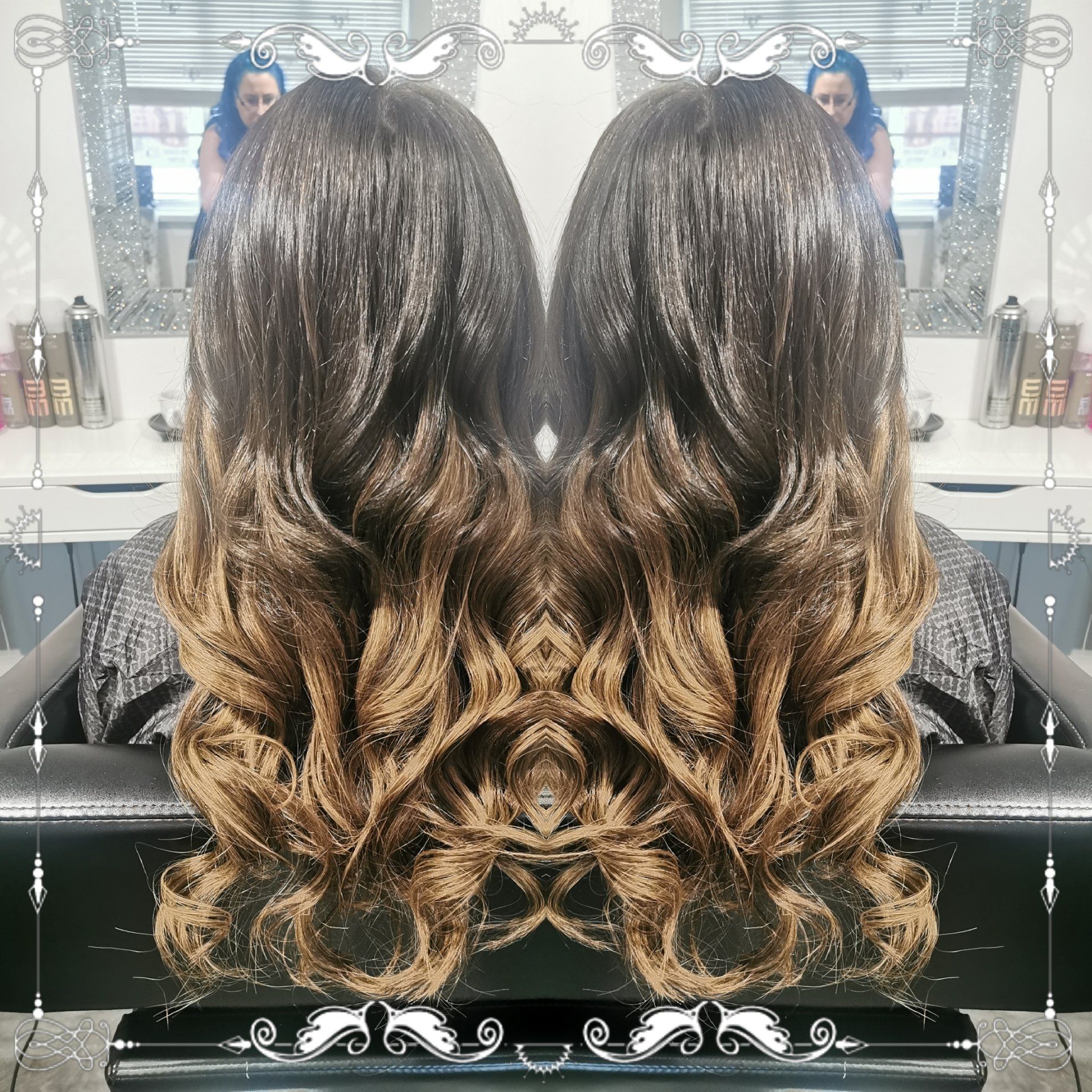 A woman with long hair is sitting in a chair in front of a mirror.