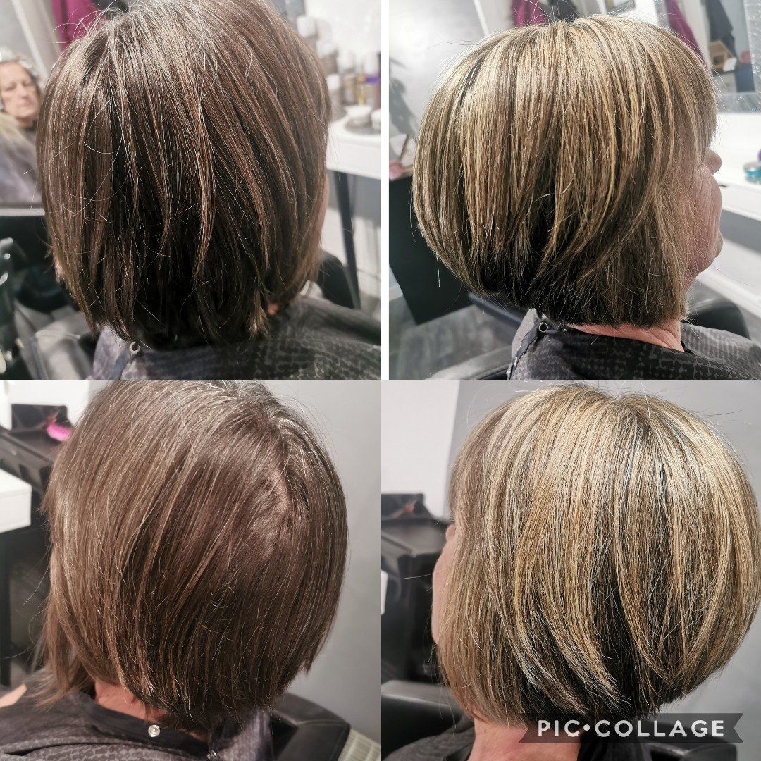 A woman is getting her hair cut in a salon.