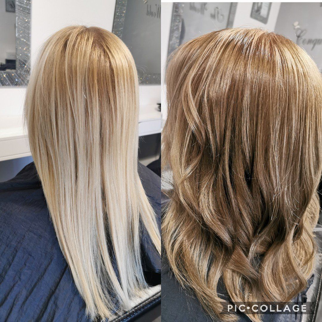 A woman with long blonde hair is sitting in a chair in front of a mirror.