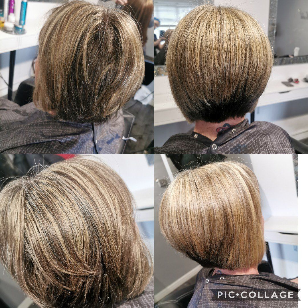 A woman is getting her hair cut in a salon