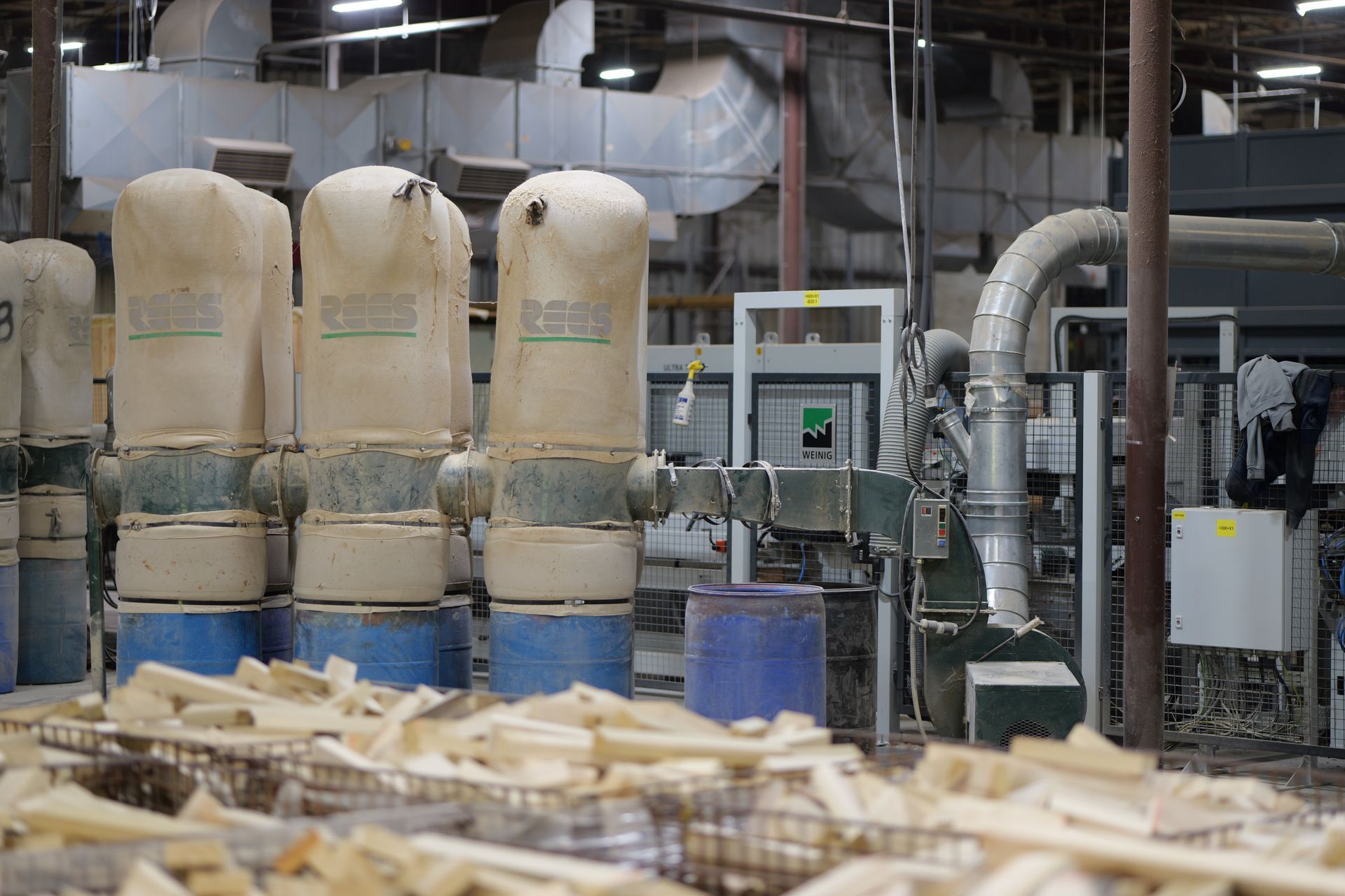 A factory filled with lots of wood and machinery.