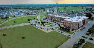 An aerial view of a city with a lot of buildings and a park.