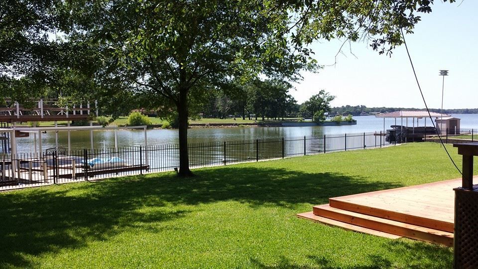 A view of a lake from a grassy area